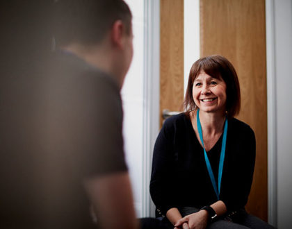 A woman counselor providing one-on-one support to a student in an office at Hartlepool Sixth Form.