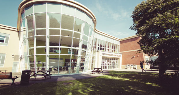 Hartlepool Sixth Form Campus Main Building's front, featuring a spacious structure with a prominent glass window.