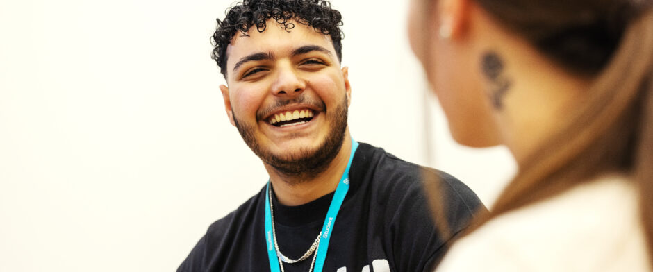 Two students talking and laughing with each other