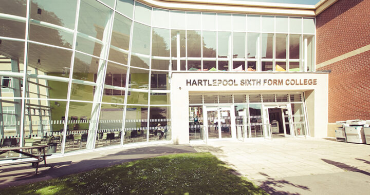 Hartlepool Sixth Form Campus Main Building's front, featuring a spacious structure with a prominent glass window.