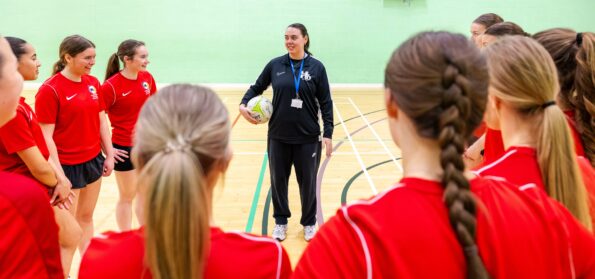Hartlepool Sixth Form College sport students taking part in a team talk before a netball session.